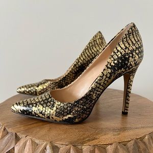 Gold and black stiletto heels